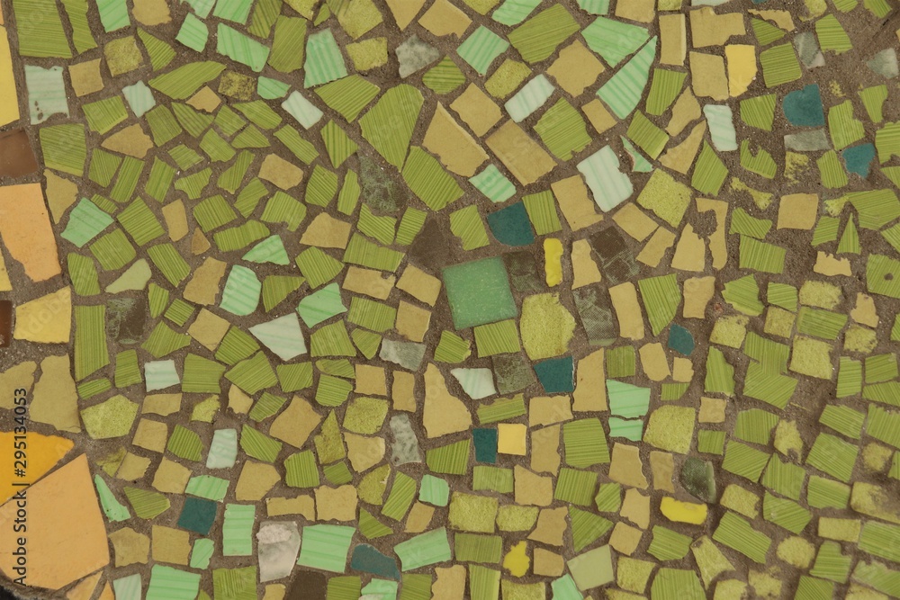surface covered with mosaic of green shades and different shapes