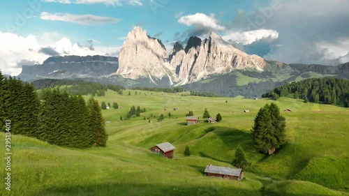 Scenic alpine mountain scenery in the Alps with cabins in summer photo