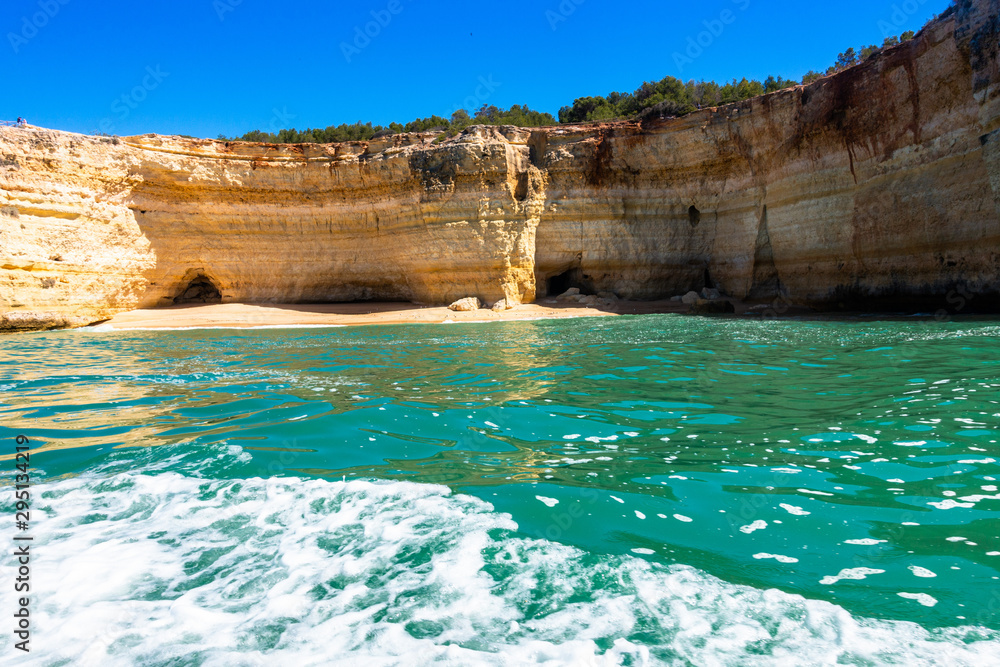 Boat trip along Algarve coastline near Benagil cave. The landscape has limestone cliffs overlooking, Atlantic Ocean, Portugal