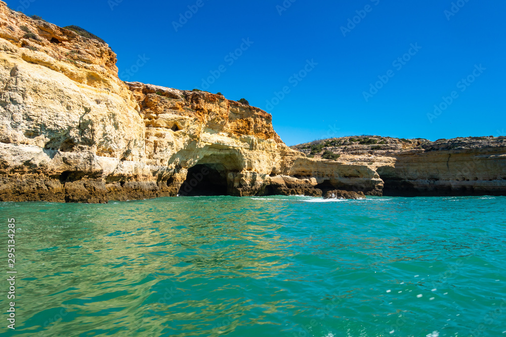 Landscape of Algarve coastline has many sea caves inside the cliffs overlooking the Atlantic Ocean, Portugal