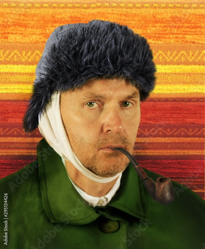 Fotografie Self-portrait of a man in a hat with a pipe in his mouth