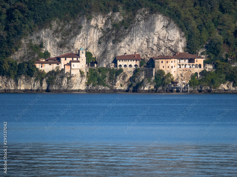 fascinating hermitage of the 13th century clinging to the cliff overlooking lake Maggiore, Italy