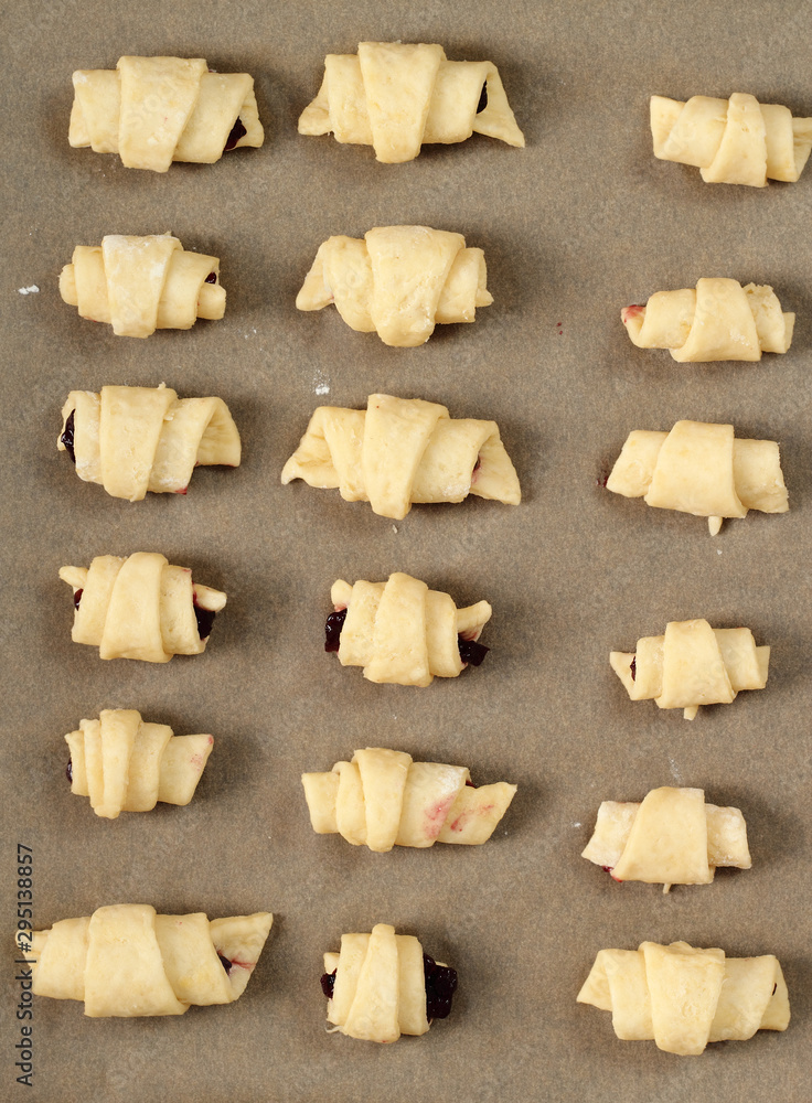 Making Croissant Cookies with Jam. Series. Transfer to baking sh Making Croissant Cookies with Jam. Series. Transfer to baking sh
