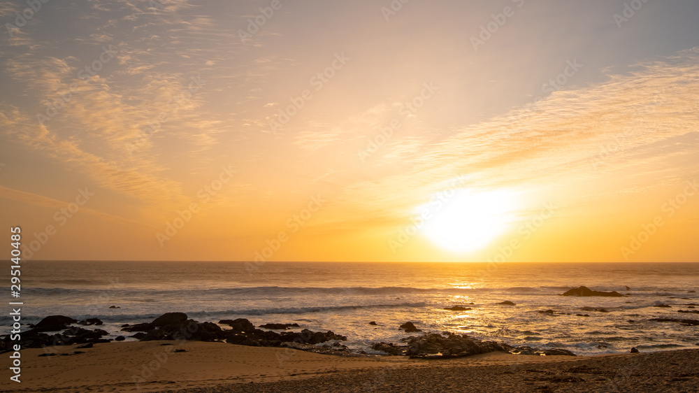 Golden sunset on beach of Povoa de Varzim, Portugal