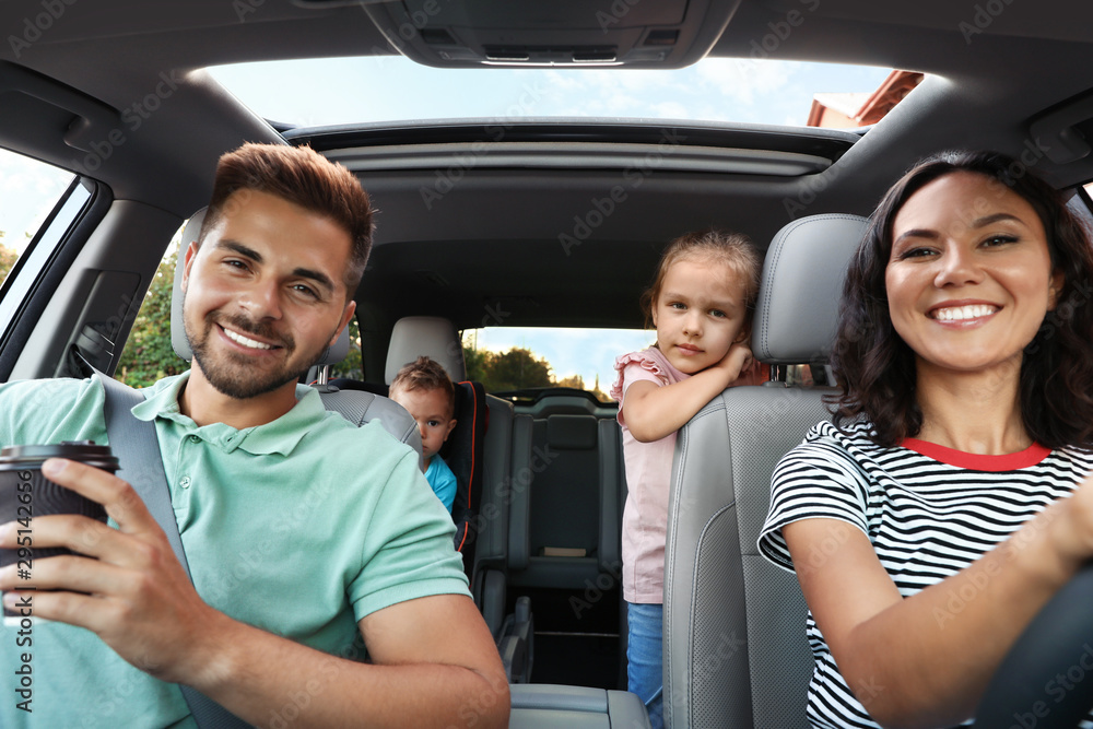 Happy family traveling by car on summer day Happy family traveling by car on summer day
