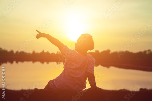 kid silhouette,Moments of the child's joy. On the Nature sunset