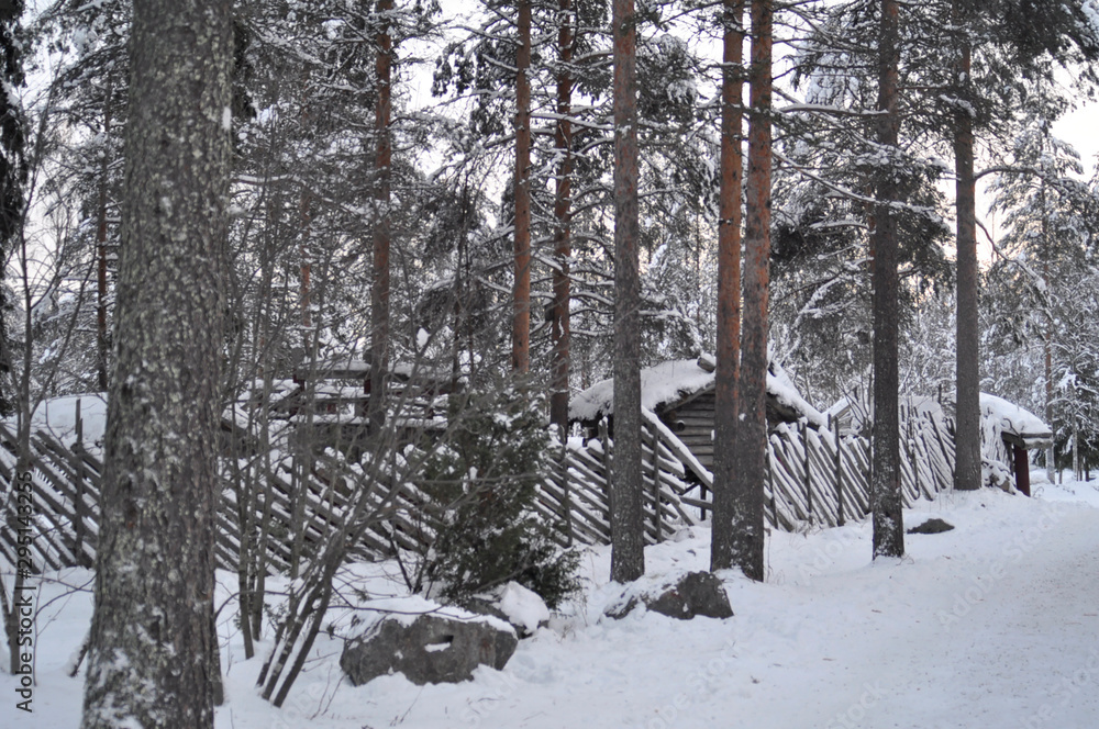 Snow covered Old wooden house in Santa Claus Village in Rovaniemi. Arctic circle, Lapland, Finland Snow covered Old wooden house in Santa Claus Village in Rovaniemi. Arctic circle, Lapland, Finland