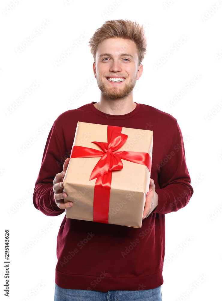 Young man with Christmas gift on white background Young man with Christmas gift on white background