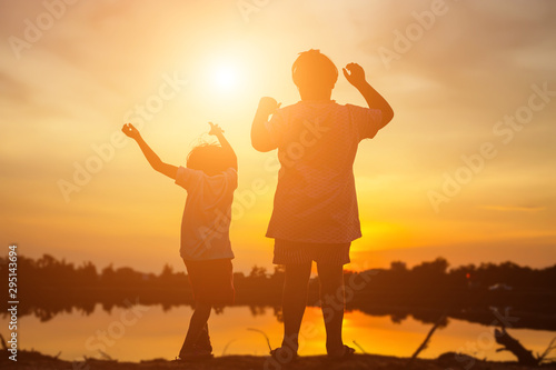 kid silhouette,Moments of the child's joy. On the Nature sunset