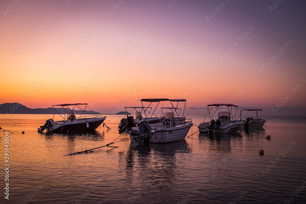 Beautiful sunrise in the little harbor on the island of Zakynthos, Greece.