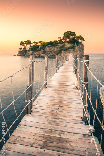 The sunrise at Agios Sostis Island, Cameo Island in Zakynthos, Greece. Wooden bridge. © petrsvoboda91