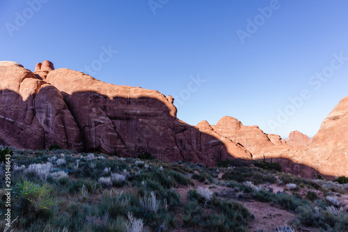 Shadow across a red rock formation