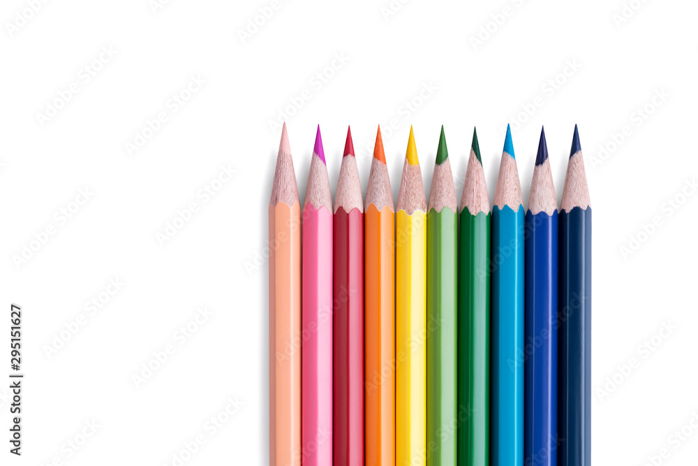 Set of bright wooden colored pencils laid out in a row in rainbow colors with empty space for text isolated on white background. Stationery background. Art and Education Concept Set of bright wooden colored pencils laid out in a row in rainbow colors with empty space for text isolated on white background. Stationery background. Art and Education Concept