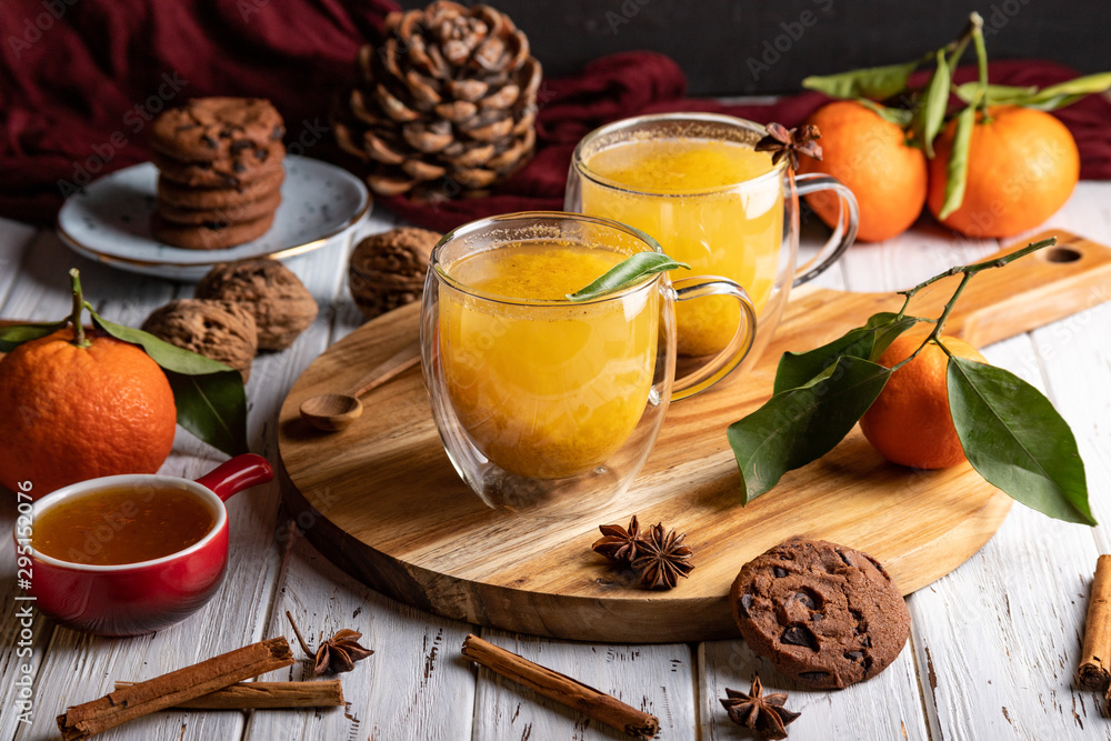Two glass cups with homemade healthy sea-buckthorn tea, selective focus Two glass cups with homemade healthy sea-buckthorn tea, selective focus