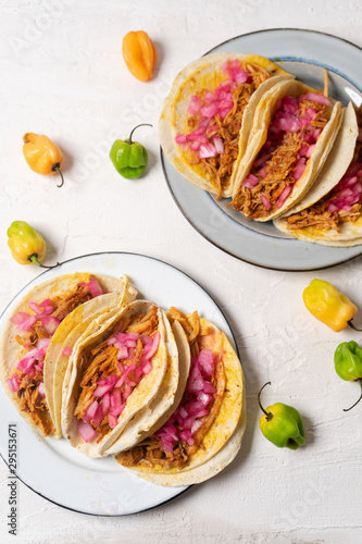 Mexican pork tacos  called cochinita pibil on white background photo