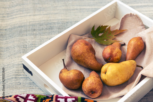 Wallpaper Mural Ripe pears and autumn leaves on a tray. Still life details of living room. Patterned blanket, fall decoration, Thanksgiving concept. Top view, copy space. Torontodigital.ca