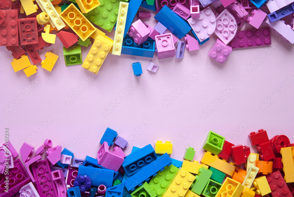 Colorful toy bricks frame with pink empty space for your content Colorful toy bricks frame with pink empty space for your content