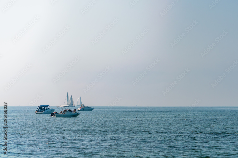 Sailboats and ships on the ocean