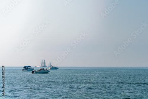 Sailboats and ships on the ocean