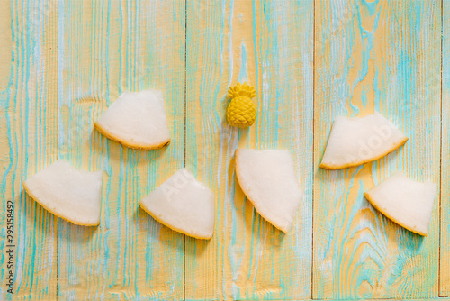 Sliced melon on blue and yellow wooden old background. Summer exotic fruits.Flat lay, top view.