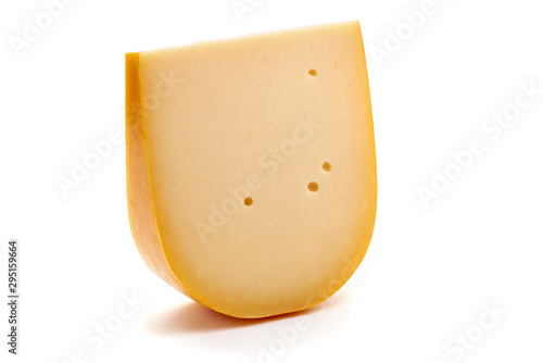 Hard Dutch gouda cheese, isolated on white background photo