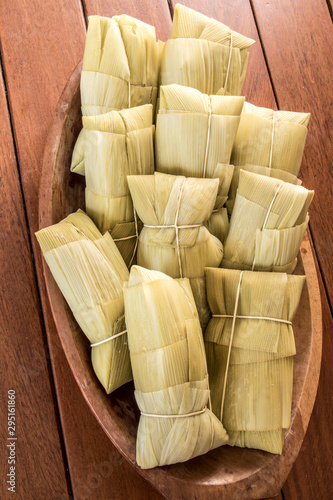 Pamonha. Brazilian Corn Snack on wooden basket in Brazil