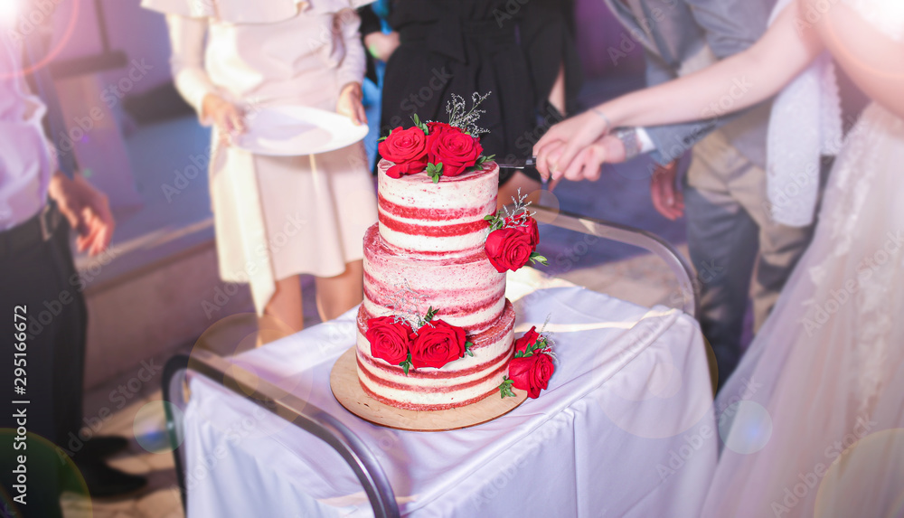 wedding chic cake with red roses. treats at the party. wedding chic cake with red roses. treats at the party.