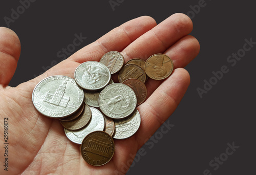 Pile of coins sitting in a hand photo