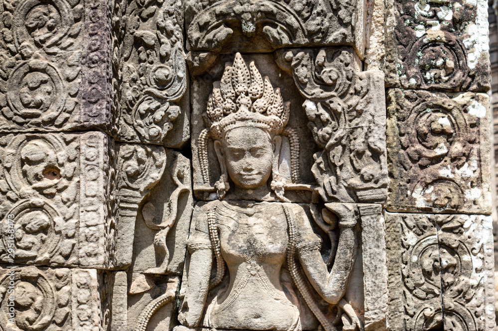 Siem Reap / Cambodia - May 27 / 2019 : engraving of a female god on the walls of bayon temple at angkor wat temple complex