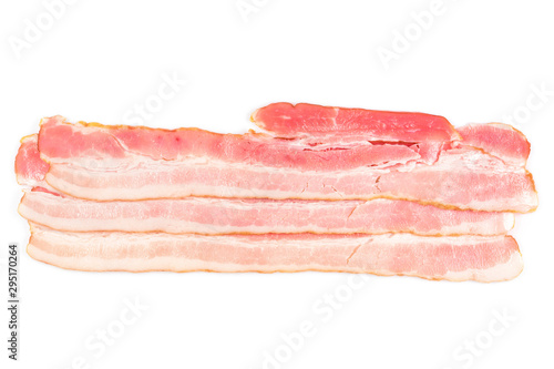 Rasher or smoked sliced bacon ready for cooking. Three pieces of pork belly, isolated on a white background, close-up.