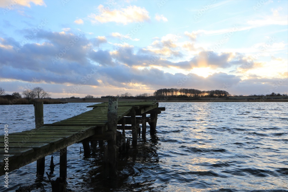 wooden jetty with scenic lake view wooden jetty with scenic lake view