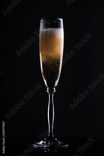 glass of champagne in the dark
