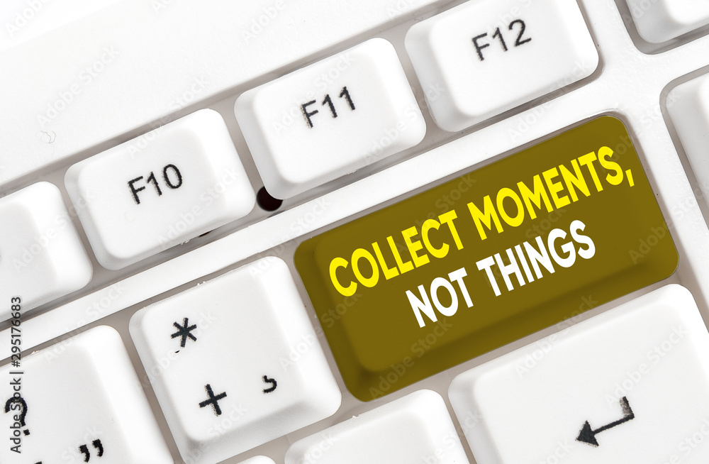 Writing note showing Collect Moments Not Things. Business concept for Happiness philosophy enjoy simple life facts White pc keyboard with note paper above the white background