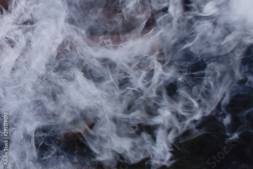 Texture of white smoke from a vape on a black background
