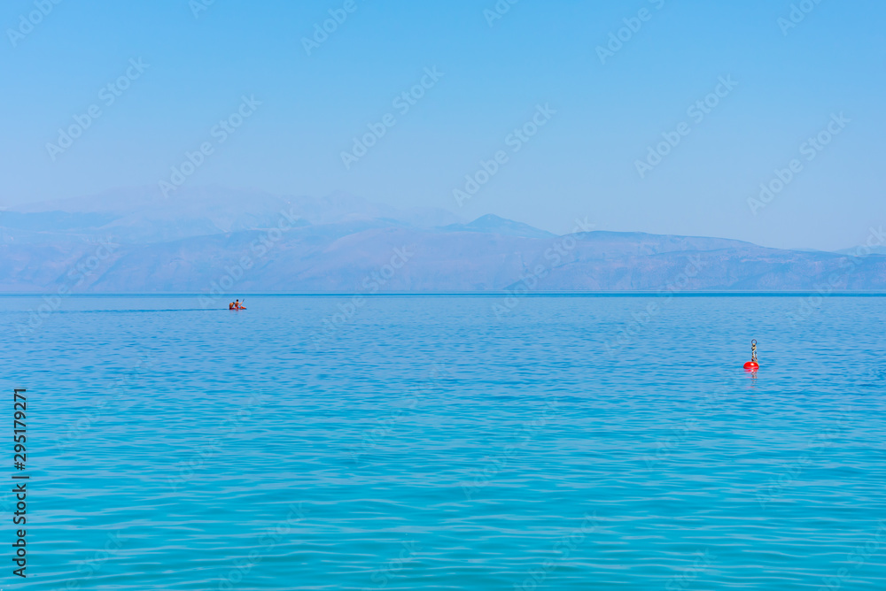 Scenic view of sea, mountains and sky