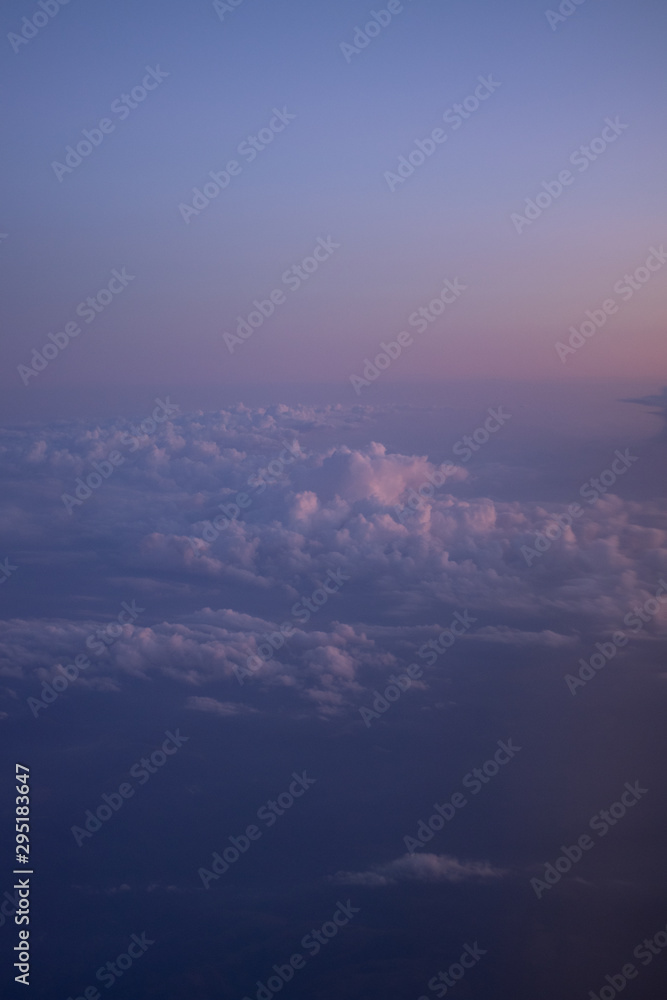Fototapeta premium The sky with clouds from a flight