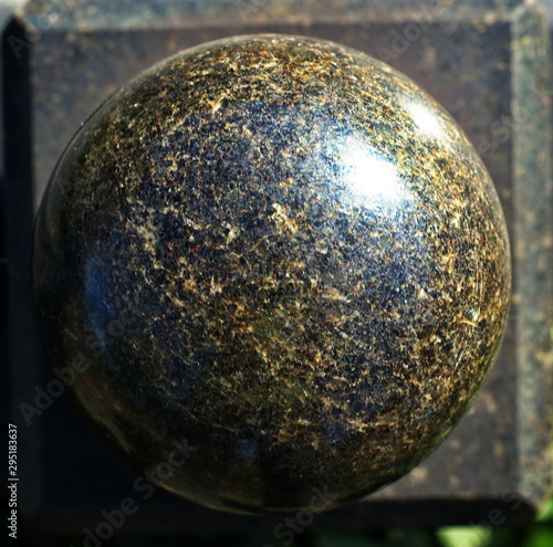 Granite stone polished ball on a granite slab