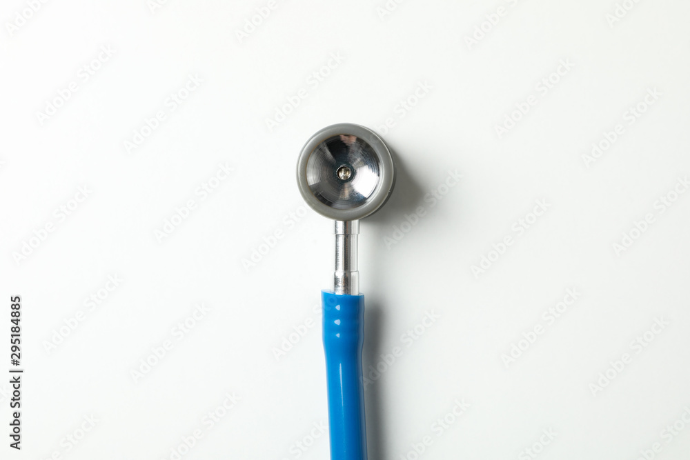 Blue stethoscope on white background, space for text Blue stethoscope on white background, space for text