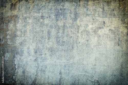 Empty gray background for sites and layouts. Photo with a concrete wall texture in spots and smudges. Toned photo with vignette.