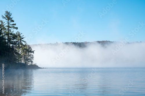 Morning Mist in Lake of Two Rivers in Algonquin Park, Ontario, Canada