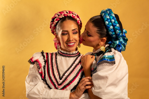 Mexican adelitas Young gay couple lesbian love hug  culture costume typical white