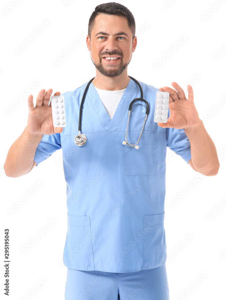 Portrait of male doctor with pills on white background Portrait of male doctor with pills on white background