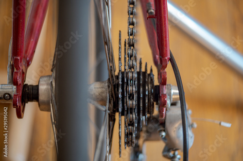 Close up view of Road Bicycle cassette looked from the back. Red bicycle with isolated cassette