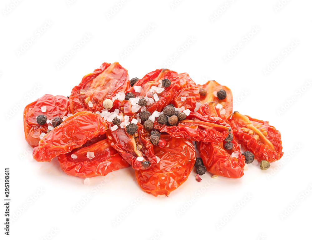 Dried tomatoes and spices on white background Dried tomatoes and spices on white background