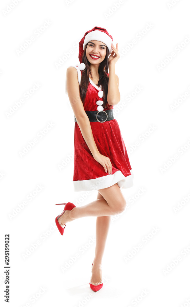 Beautiful young woman in Santa Claus costume on white background Beautiful young woman in Santa Claus costume on white background