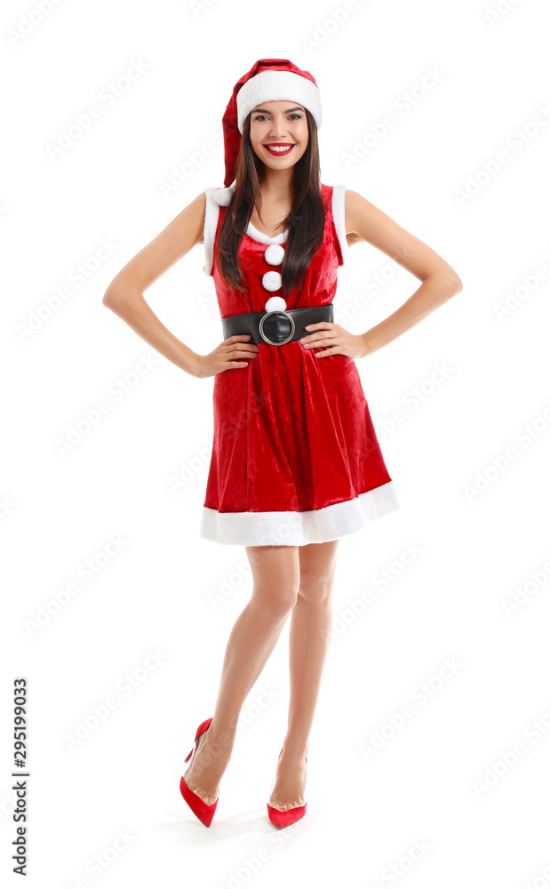 Beautiful young woman in Santa Claus costume on white background Beautiful young woman in Santa Claus costume on white background