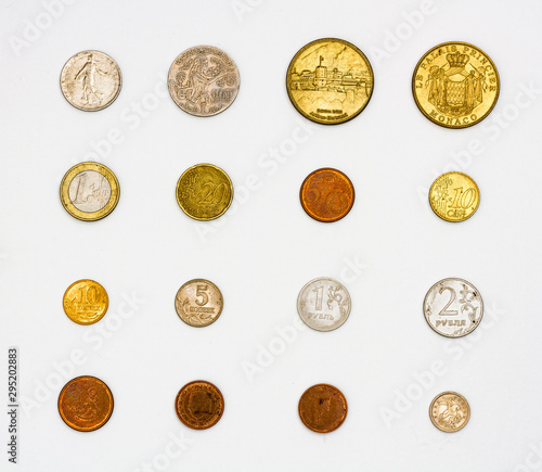 Quadro su tela Set of worn coins of different values and materials, pewter and copper coins of different countries heads and tails, a collection of numismatist souvenir coins of Monaco, Euro, pound, franc, ruble