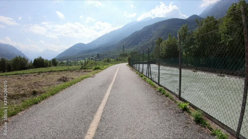 bicycle path along the Saint Clair hydroelectric canal next to Fenis, Aosta Valley, Italy bicycle path along the Saint Clair hydroelectric canal next to Fenis, Aosta Valley, Italy