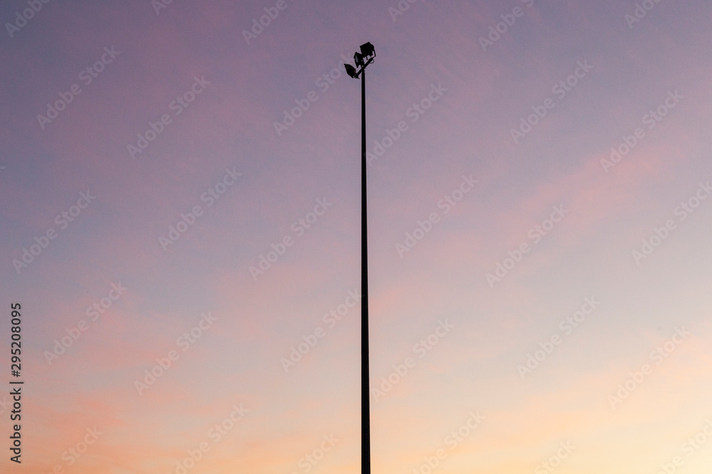 Sporting field light tower turned off during golden hour light. Sporting field light tower turned off during golden hour light.
