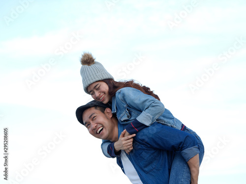 Young Asian couple in blue shirt enjoy together happy and smile romantic time together